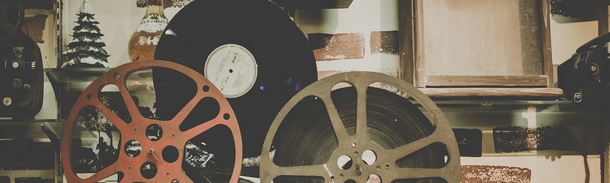 Old movie projector with a film reel on