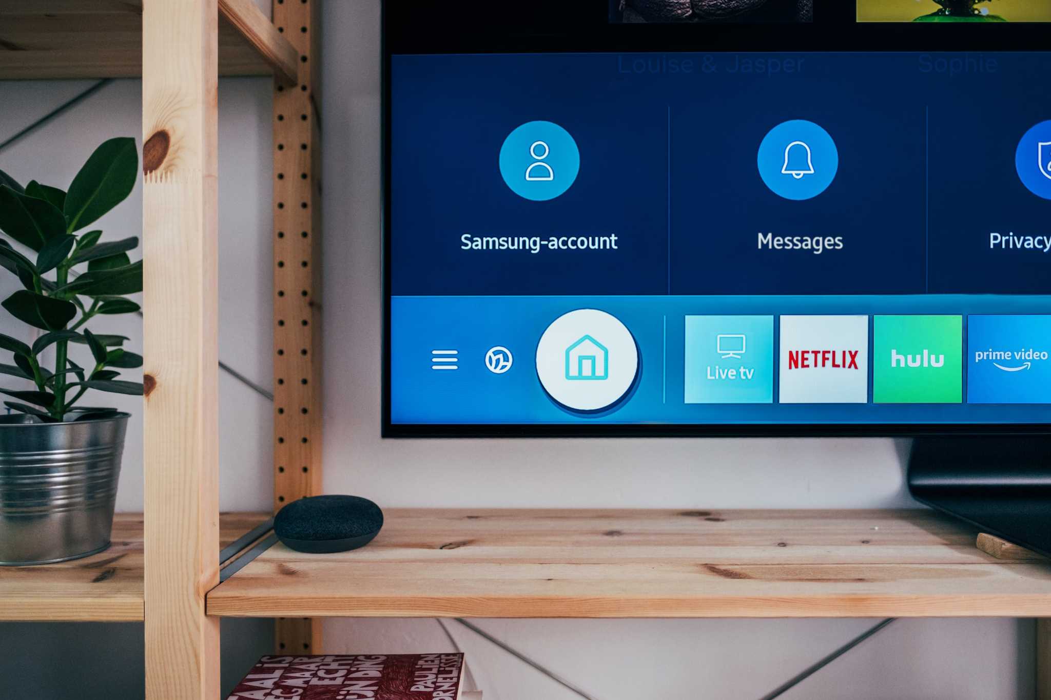 The screen of a Samsung TV displaying links to several apps. Image courtesy of Jonas Leupe on Unsplash.
