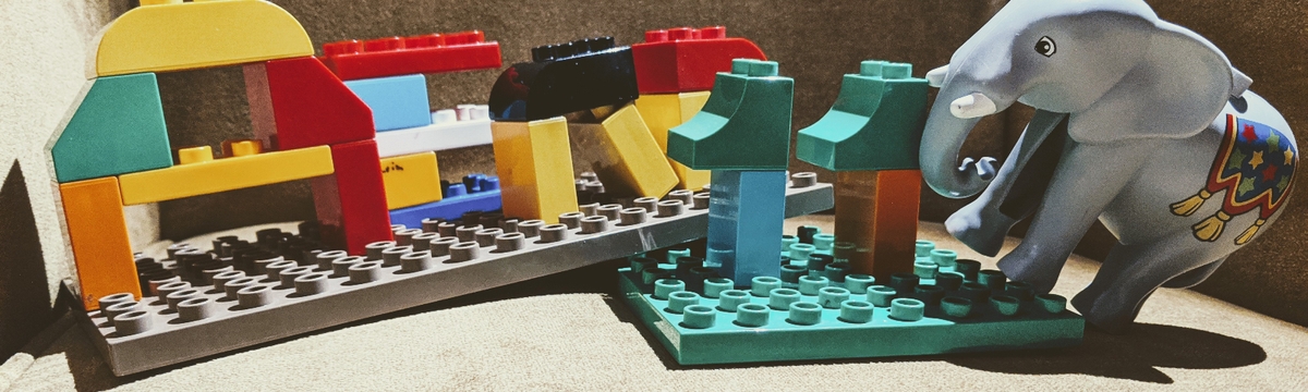 Lego bricks and an elephant toy.