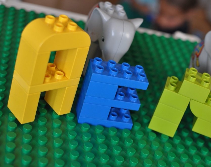 Lego blocks AEM sign with two Lego elephants in the background.